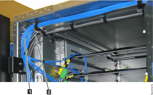Routing rack-to-rack power control and FCAL cables on top of the sheet metal tray